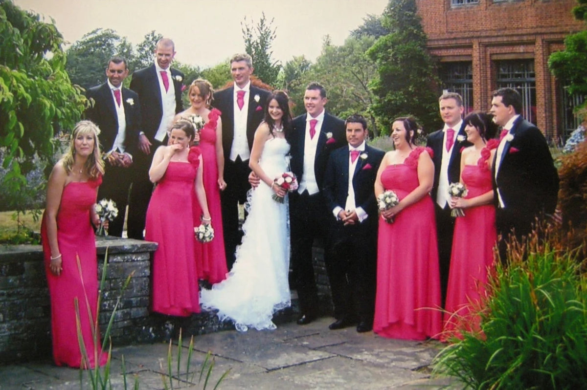 Real XCLUSIV bride with her wedding party in fuchsia bridesmaid dresses