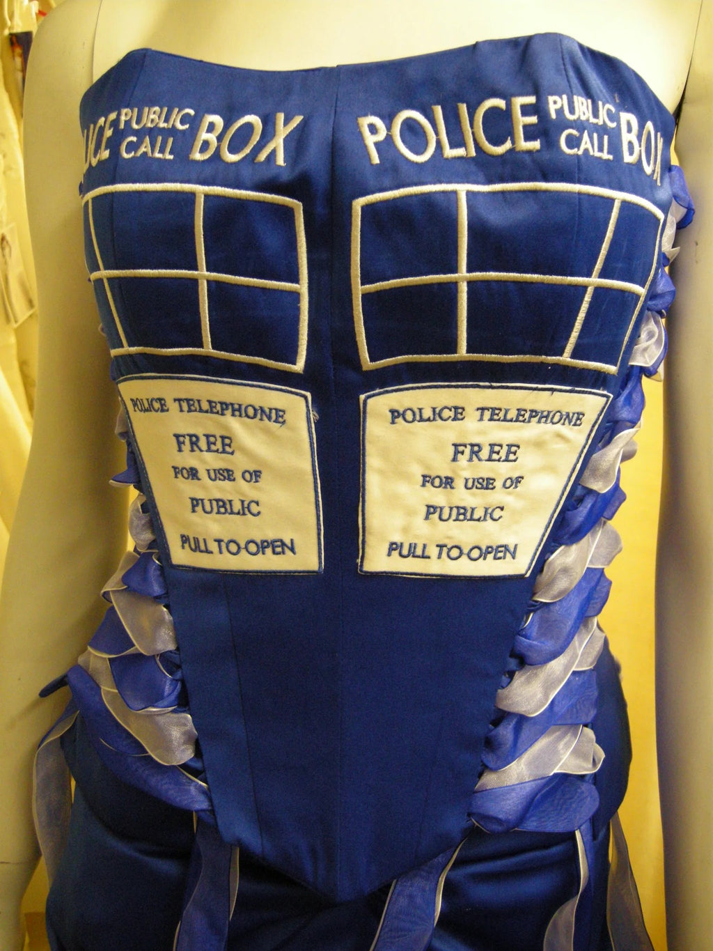 Police box bodice lettering close-up – XCLUSIV Horsham