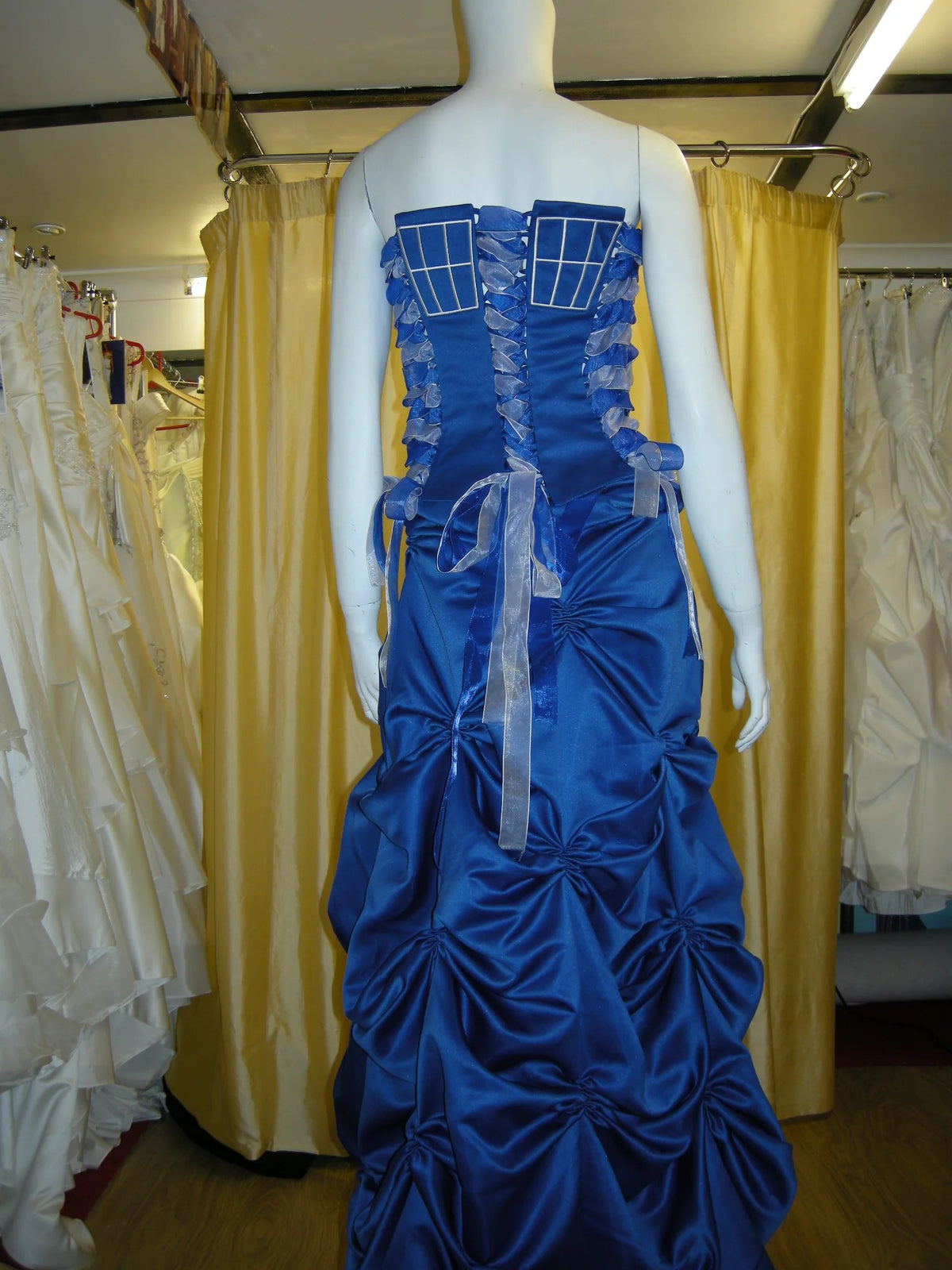 Blue satin gown with pick-up skirt – XCLUSIV Horsham