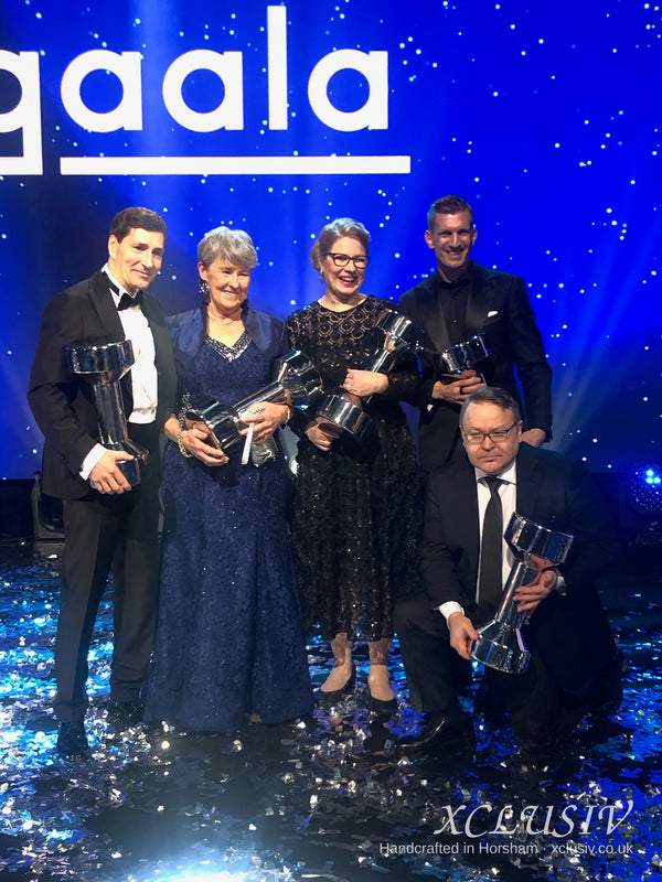 Real XCLUSIV client wearing her bespoke navy lace gown and royal blue bolero at an awards gala