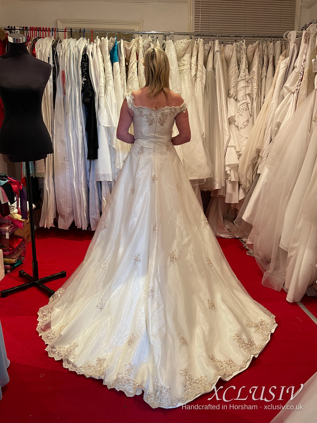Ivory Satin Off-Shoulder A-Line Wedding Dress with Gold Embroidery – XCLUSIV Horsham (view 2)