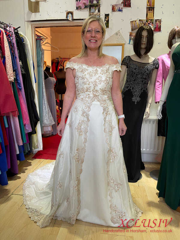 Ivory Satin Off-Shoulder A-Line Wedding Dress with Gold Embroidery – XCLUSIV Horsham (view 3)