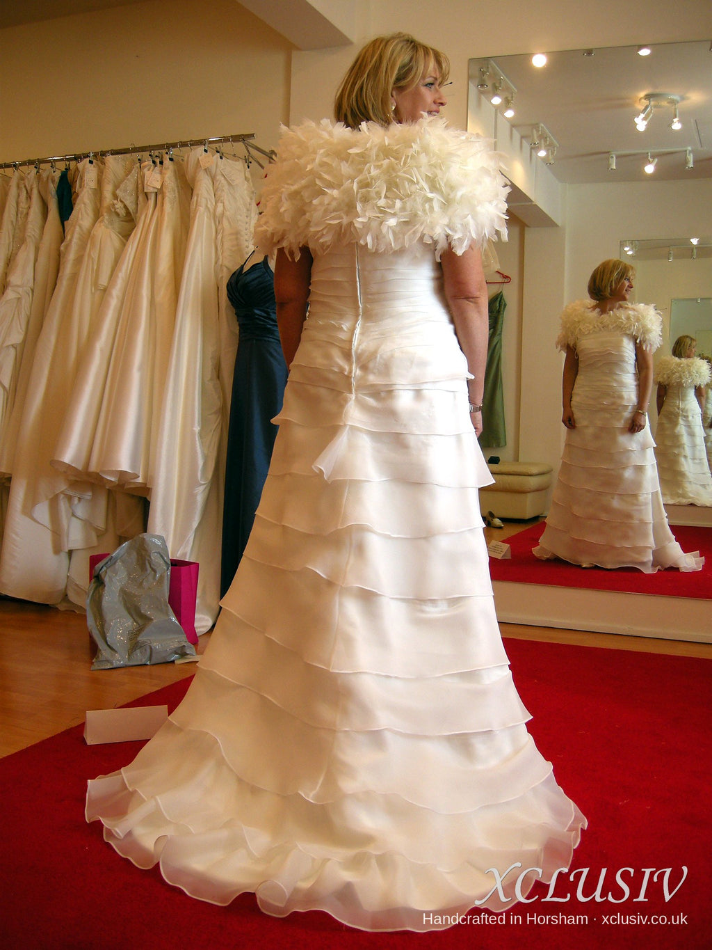 Ivory Tiered Organza Wedding Dress with Feather Wrap – XCLUSIV Horsham